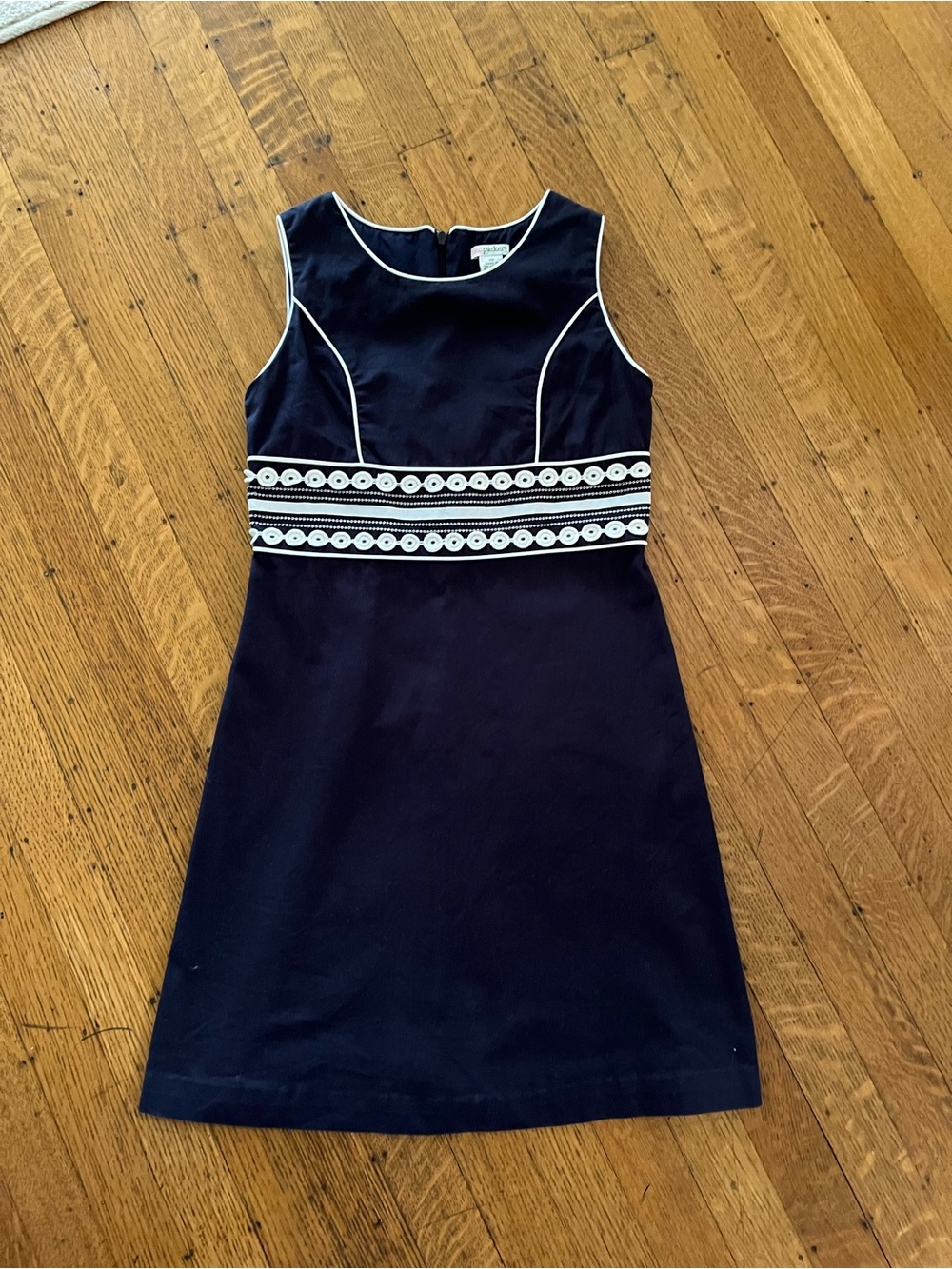 Sleeveless Navy Girls' A-Line Dress with White Piping and Embroidered Waist